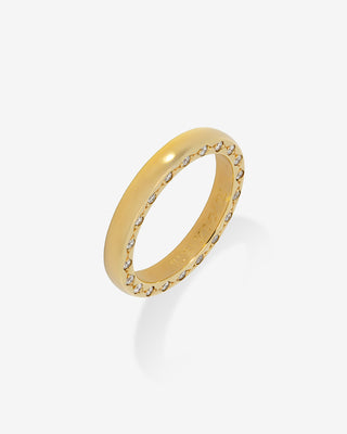 Gold ring with embedded stones on a white background
